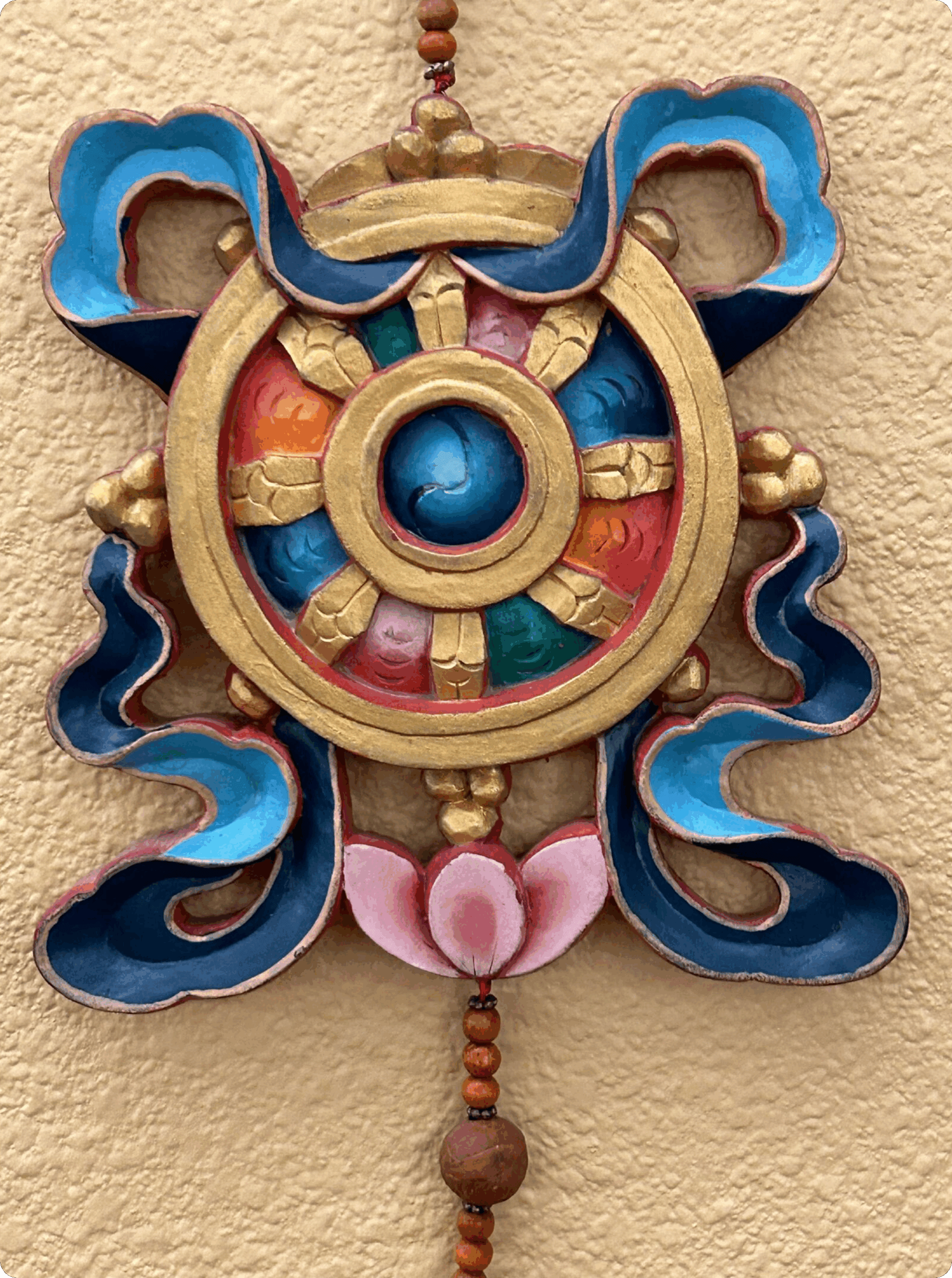 Decorative wheel with vibrant colors and intricate design.