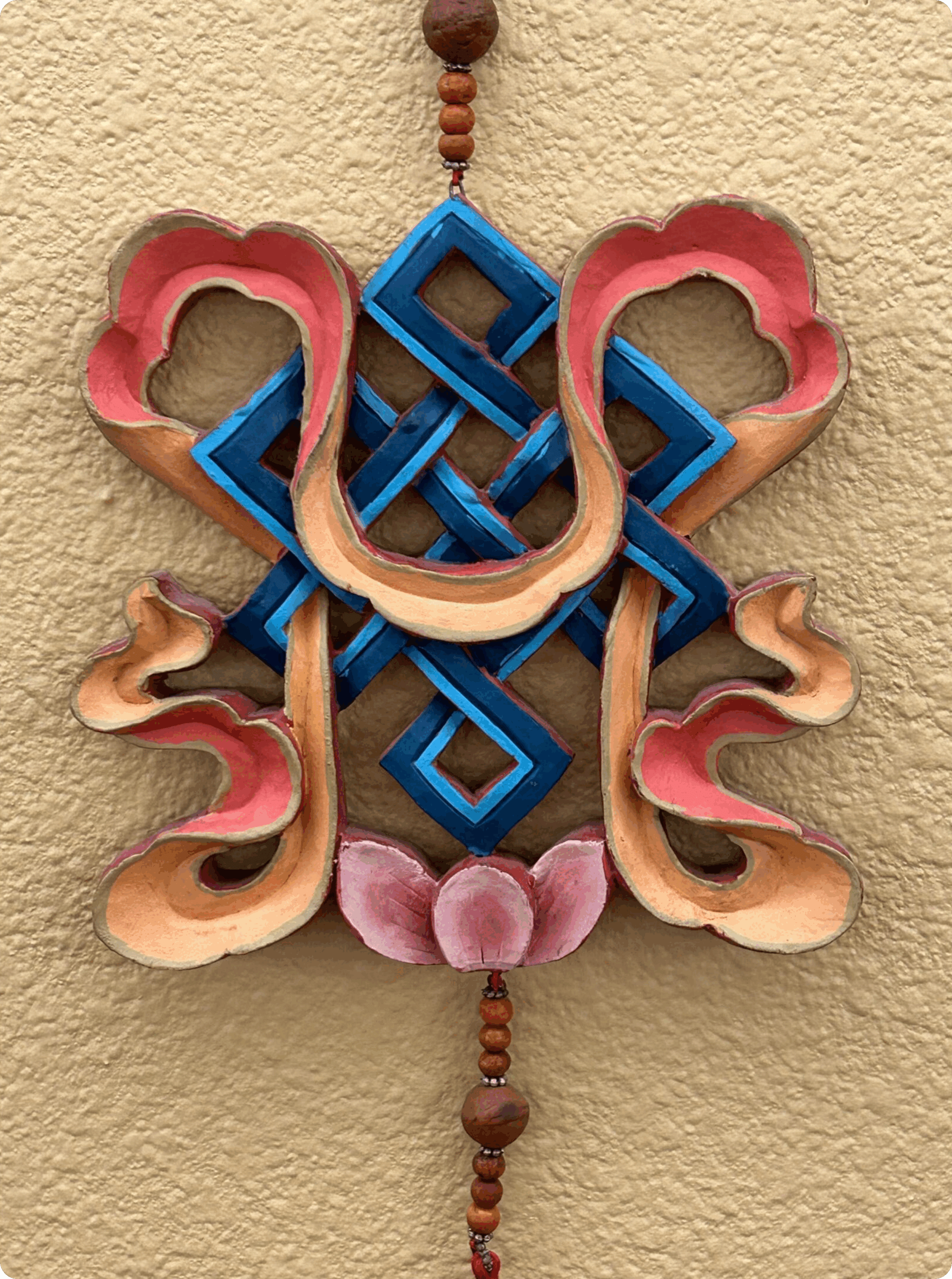 Intricate wooden carving with geometric and organic patterns.